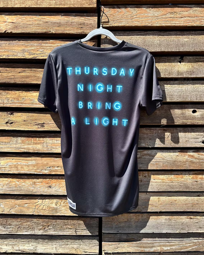 Back of Ride and Pint shirt with text "Thursday Night Bring a Light"